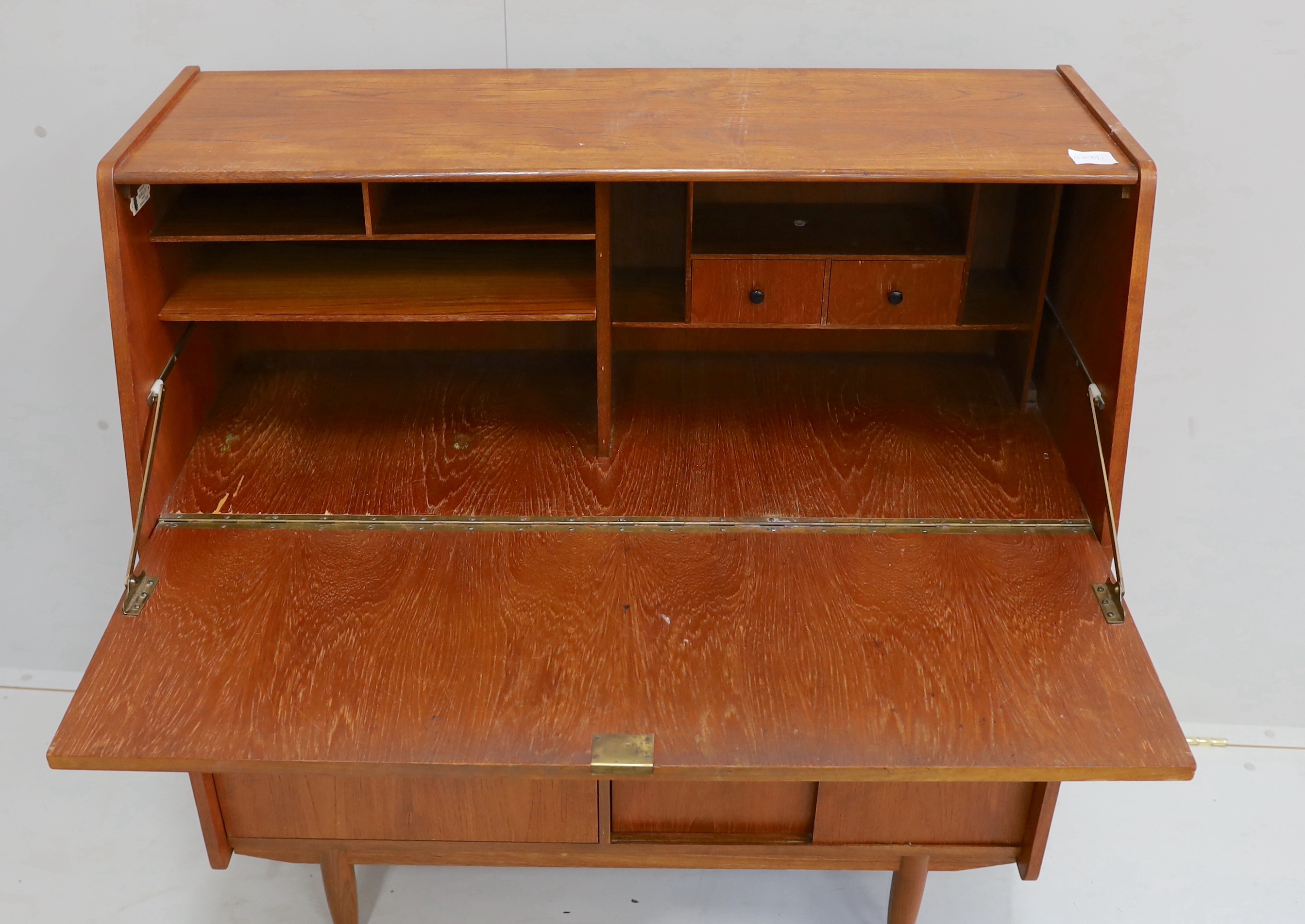 A mid century teak bureau, width 99cm, depth 41cm, height 104cm